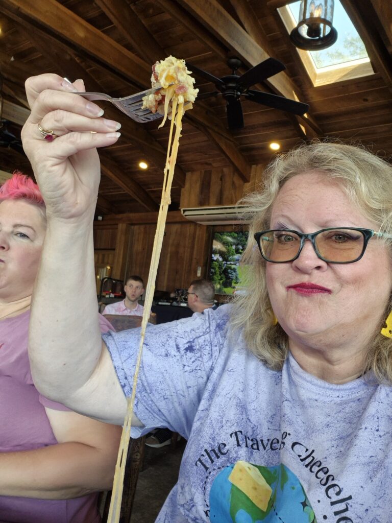 the Traveling Cheesehead eating a VERY cheesy omelette