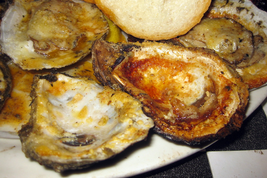 Best Local Places to Eat in New Orleans Chargrilled oysters from Acme Oyster House